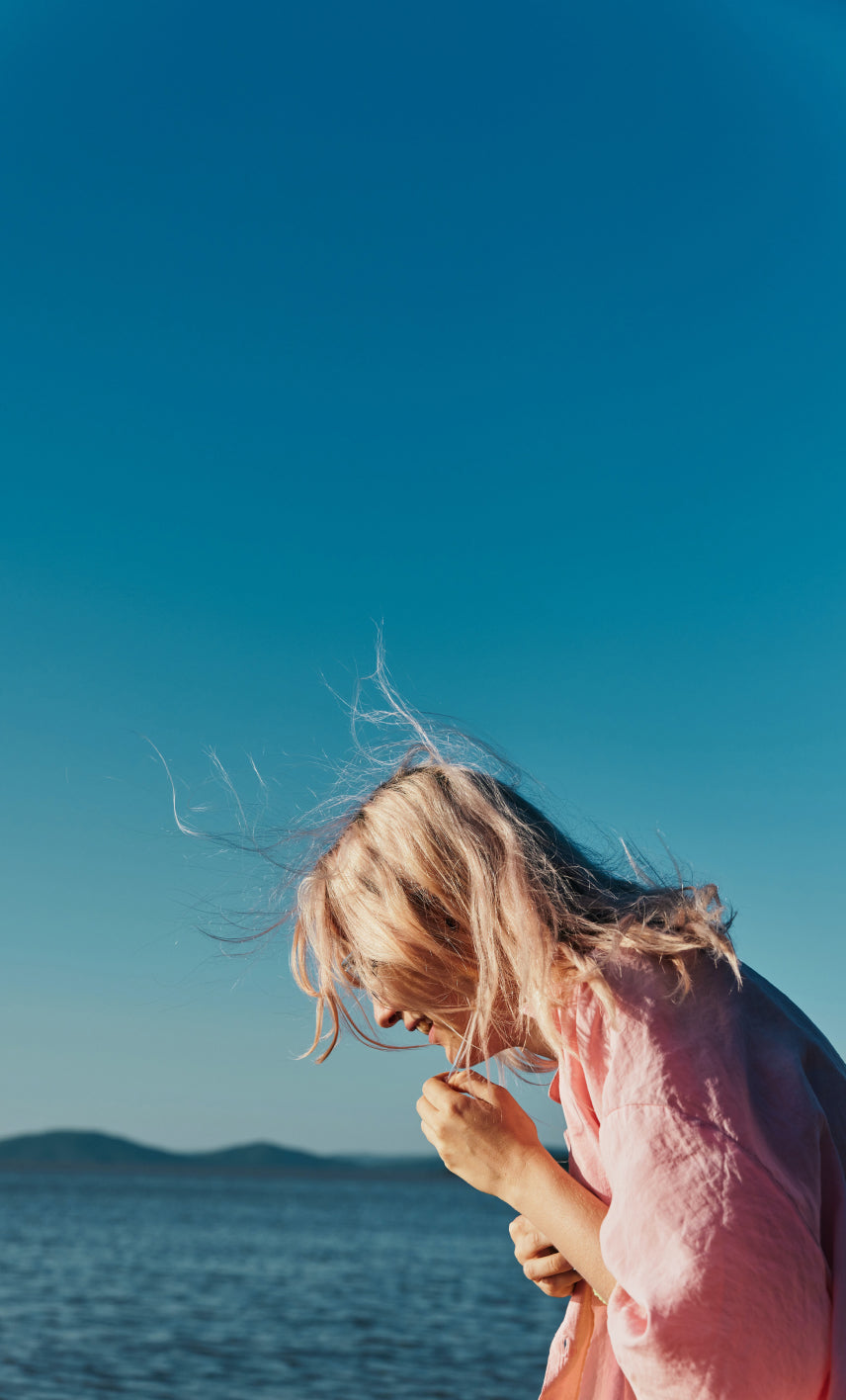 Woman outside near a body of water