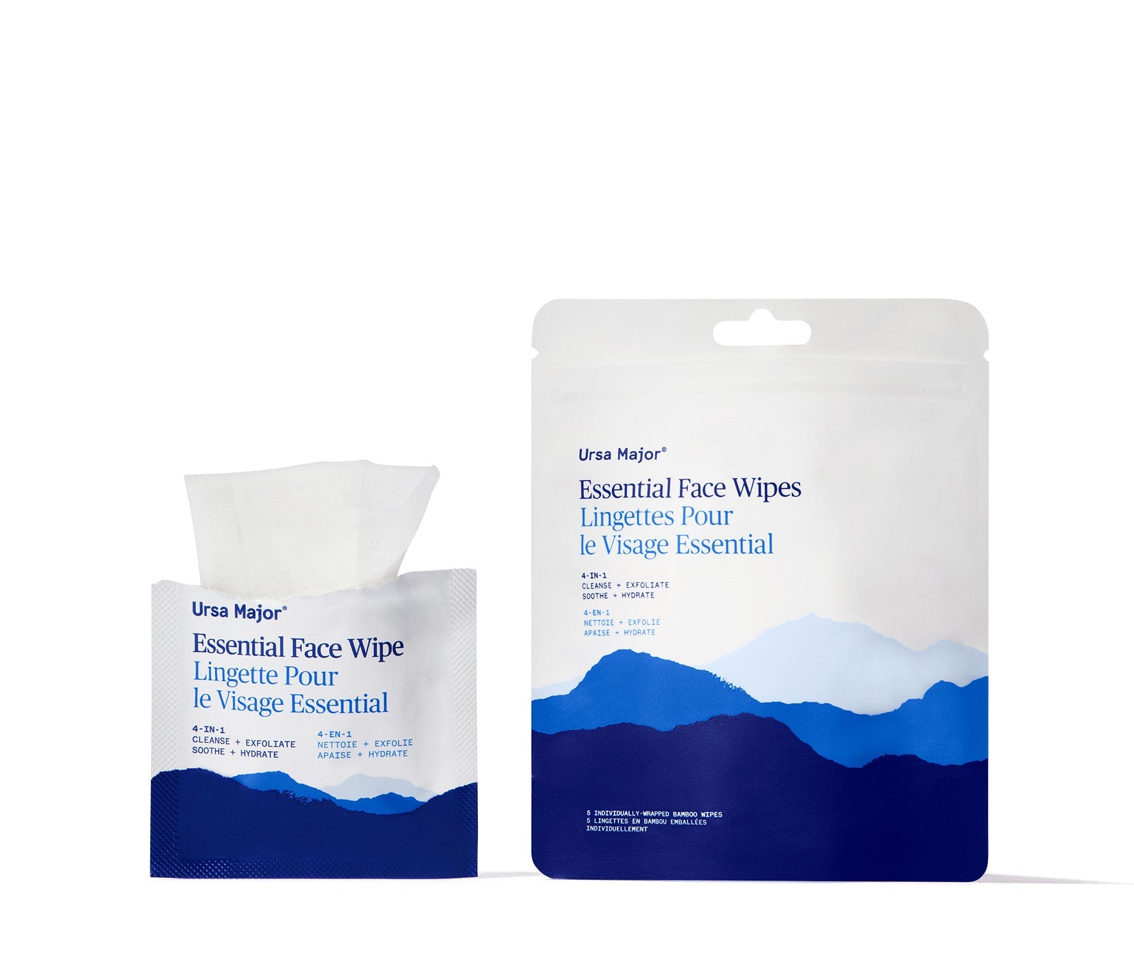 Open packet of Ursa Major Essential Face Wipes, with wipe peeking out of packet, next to a larger pouch with blue mountain design on a white background