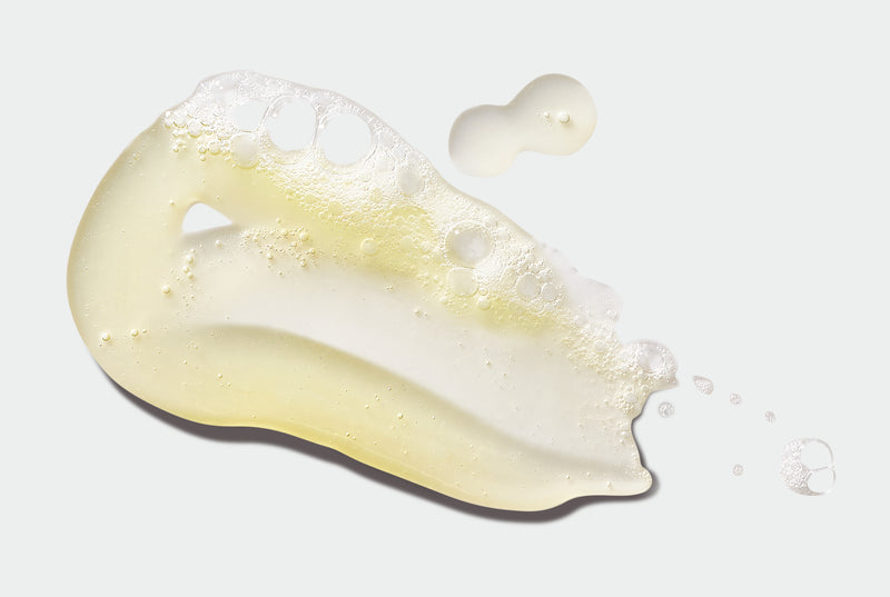 Close-up of foaming Body Wash a light gray background