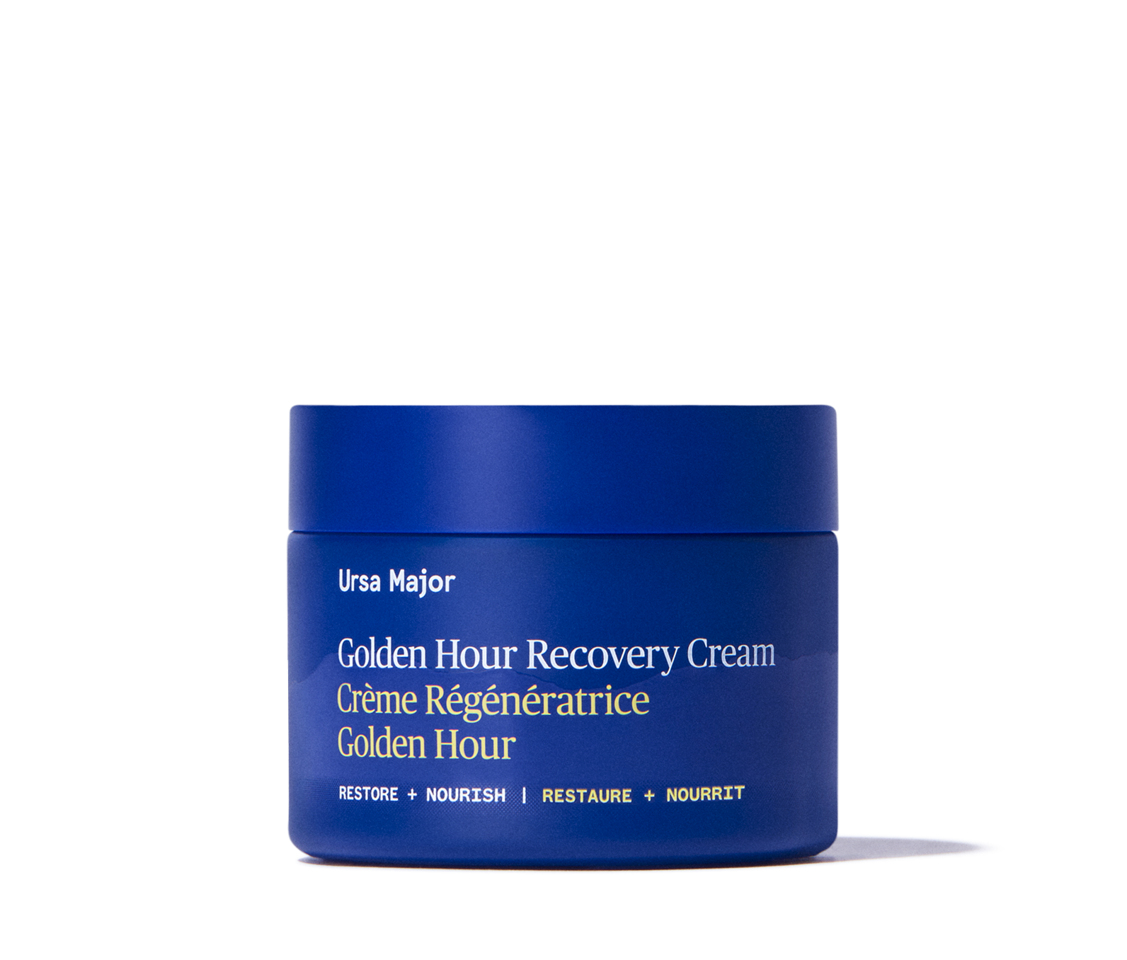 Blue jar of Ursa Major Golden Hour Recovery Cream on a white background