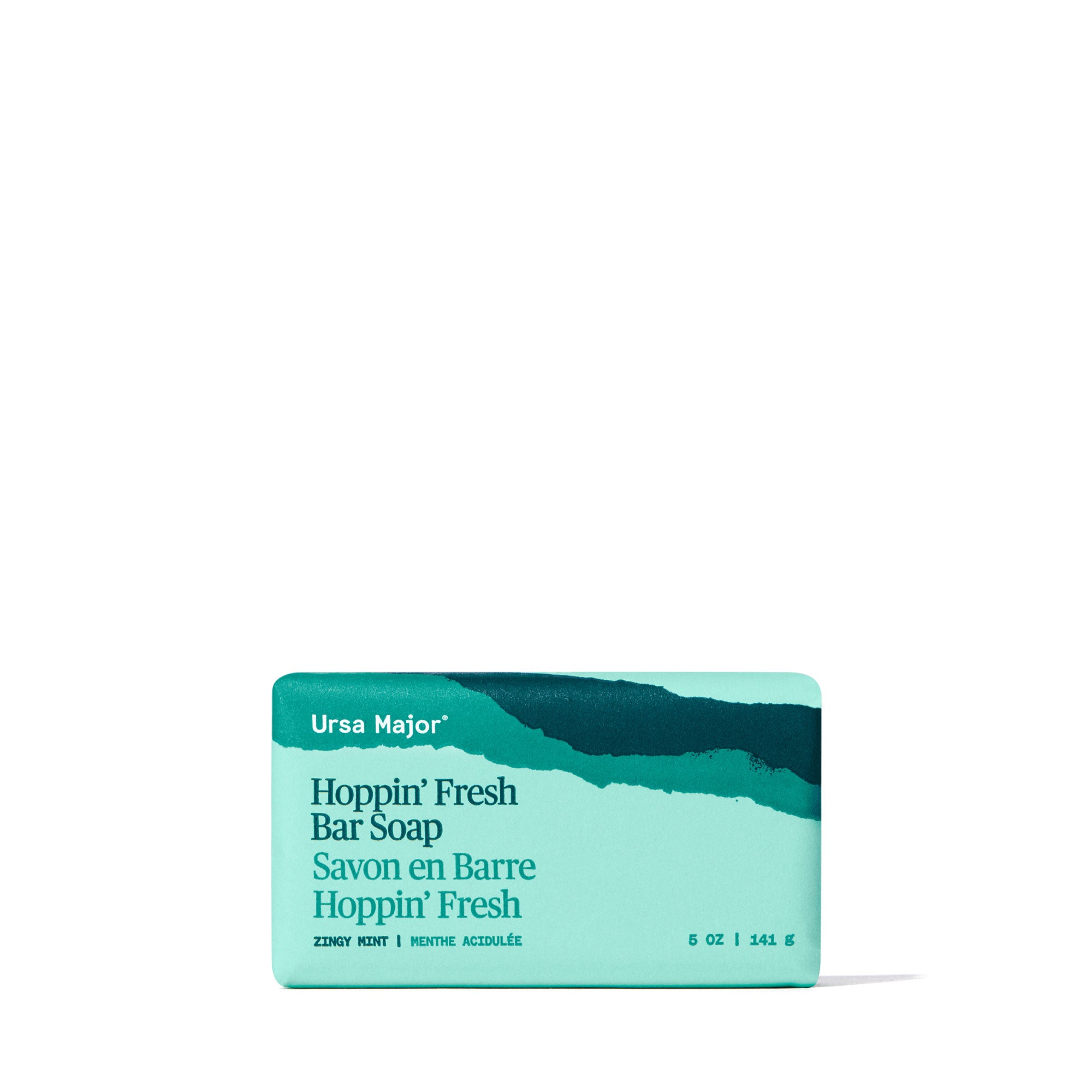 Blue-green wrapped Ursa Major Hoppin' Fresh Bar Soap on a white background