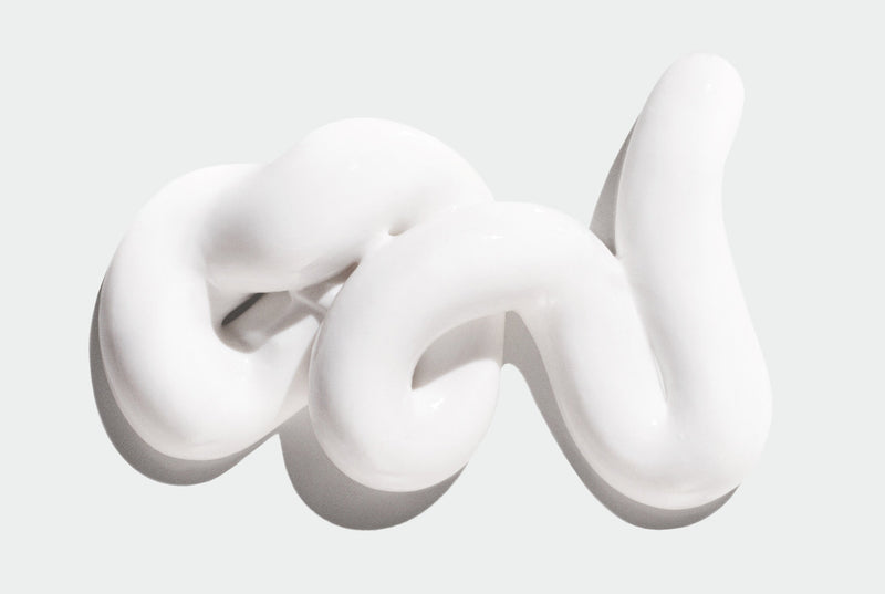 White smear of Shave Cream on a light gray background