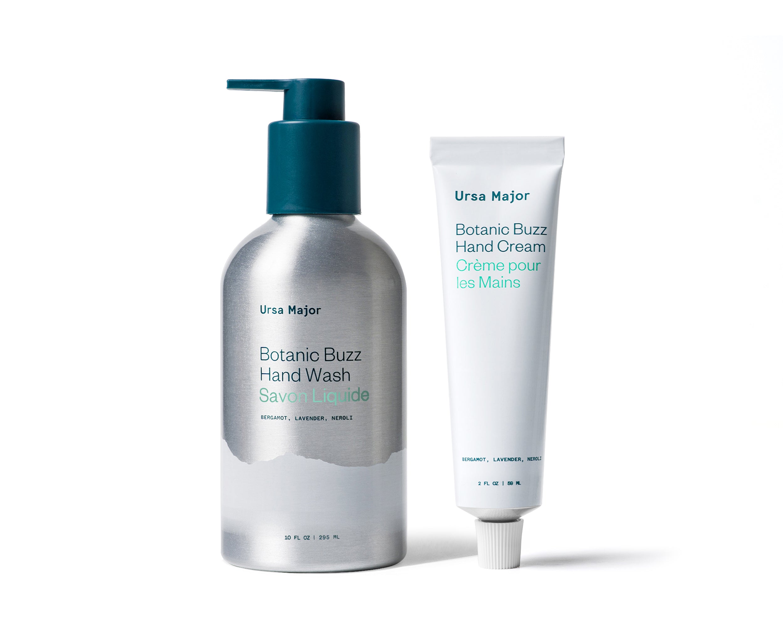 Aluminum bottle of Ursa Major Botanic Buzz Hand Wash next to white tube of Botanic Buzz Hand Cream on a white background