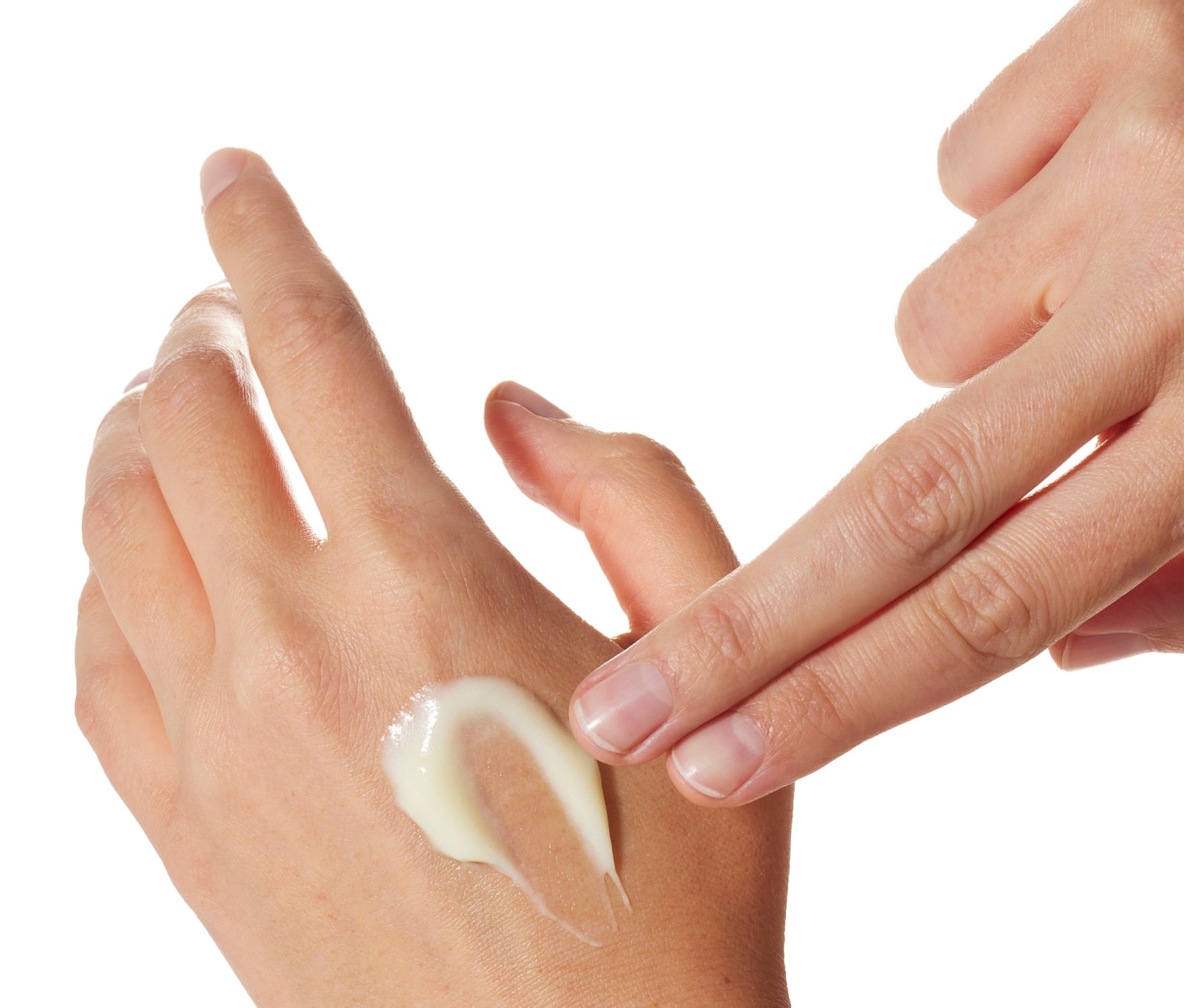 Hand swiping Ursa Major Botanic Buzz Hand Cream onto the other hand on a white background