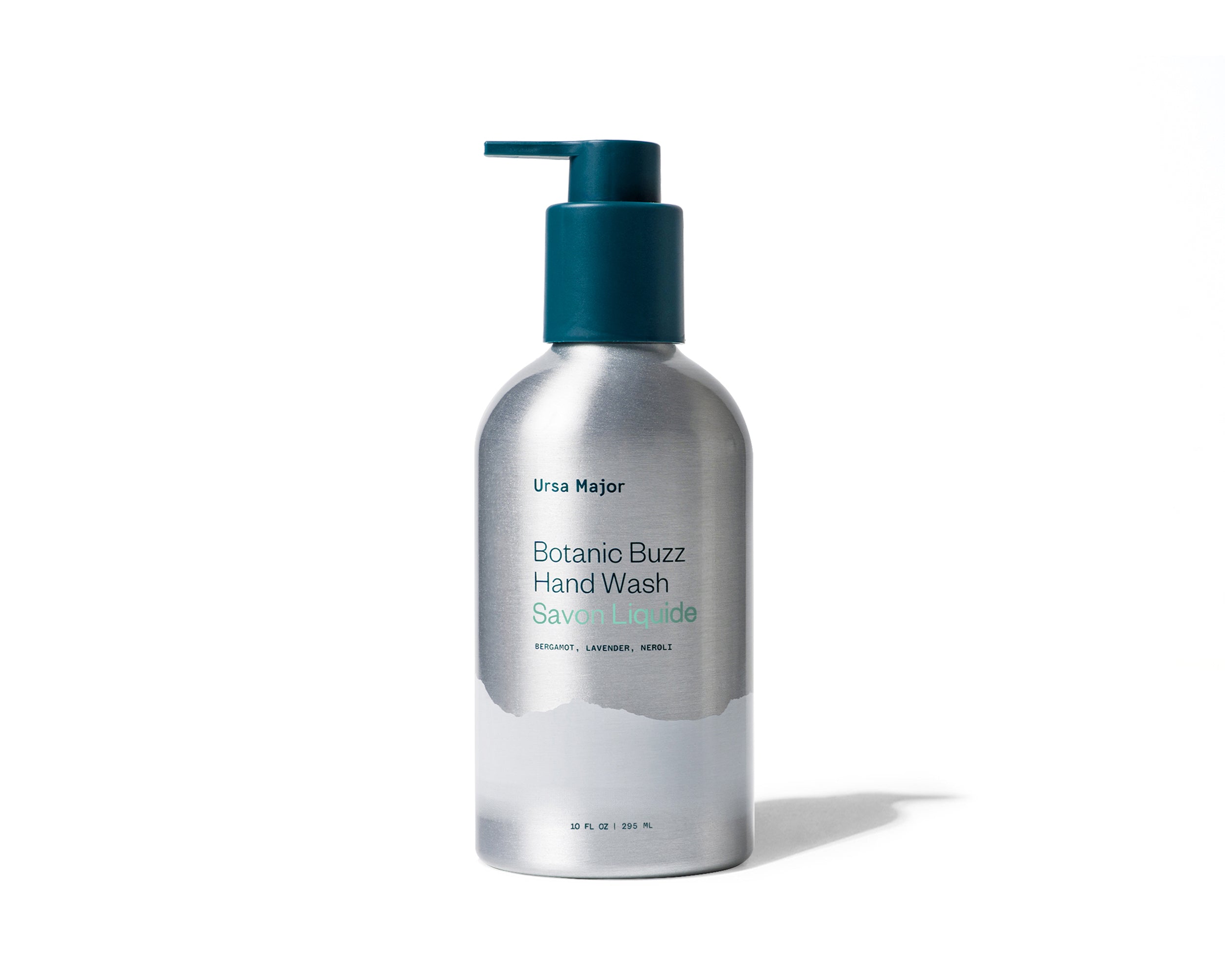 Aluminum bottle of Ursa Major Botanic Buzz Hand Wash with a green pump on a white background