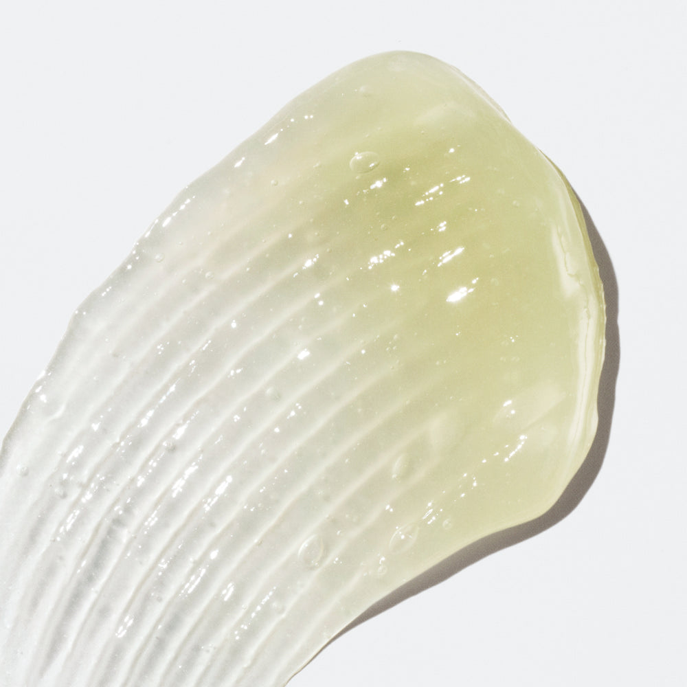 Translucent liquid with a light-green color on a white background.