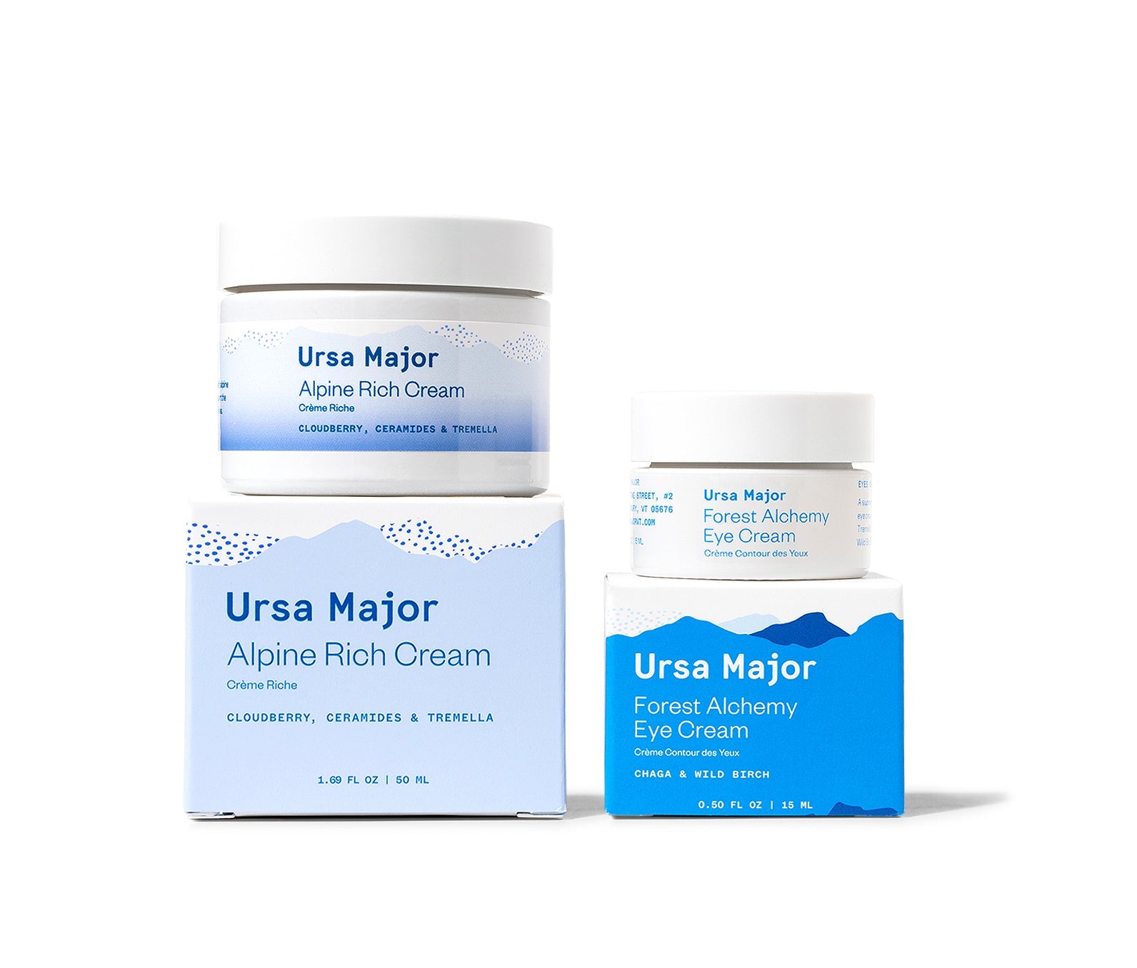 Ursa Major Skincare Forest Bliss Bundle.  One jar of Alpine Rich Cream and one jar of Forest Alchemy Eye Cream on a white background.  Both jars are sitting on top of their boxes.