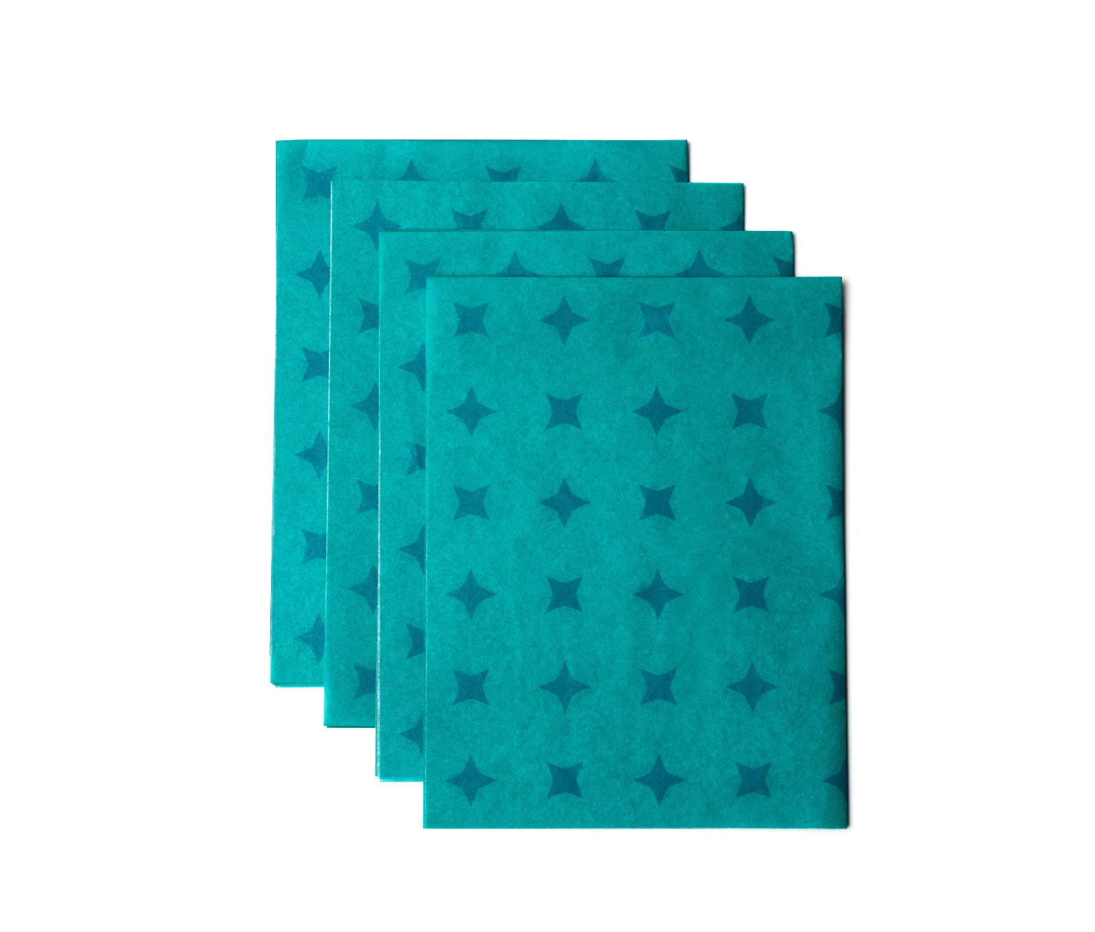 Five sheets of teal tissue paper with dark blue starts on it.
