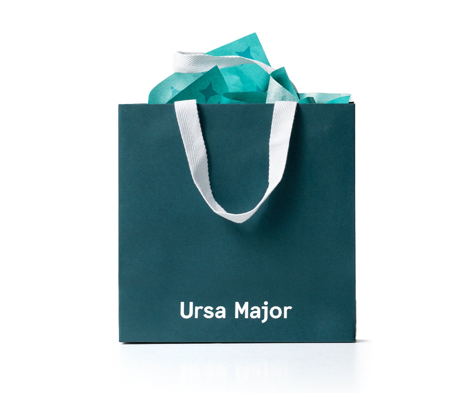 Teal bag with 'Ursa Major' branding, filled with teal tissue paper.