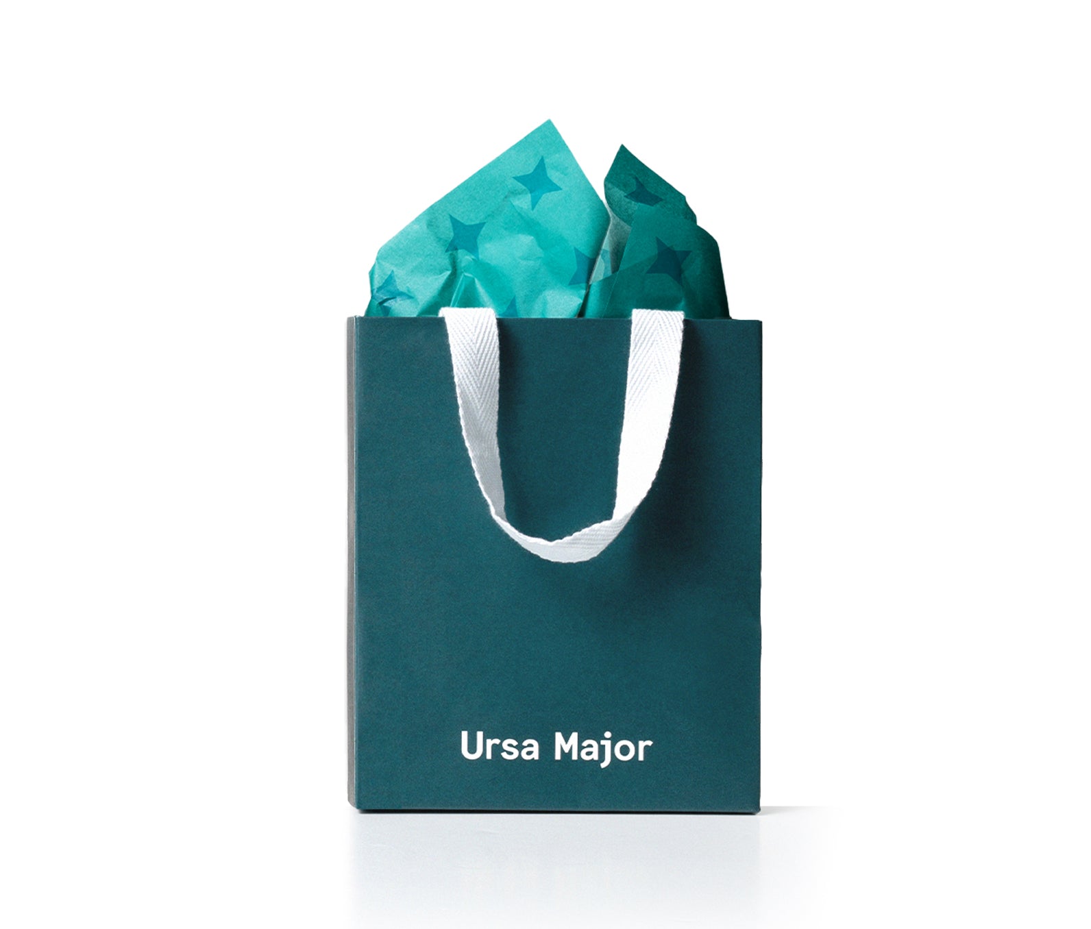 Teal bag with 'Ursa Major' branding, filled with teal tissue paper.