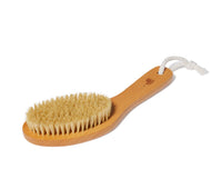 Wooden Dry Brush with bristles, a rope handle, and Ursa Major bear logo lying flat on a white background