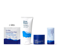 Set of Ursa Major skincare products including face wash, cream, and wipes on a white background