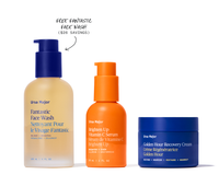 Three skincare products from Ursa Major on a white background with text indicating a free face wash offer.