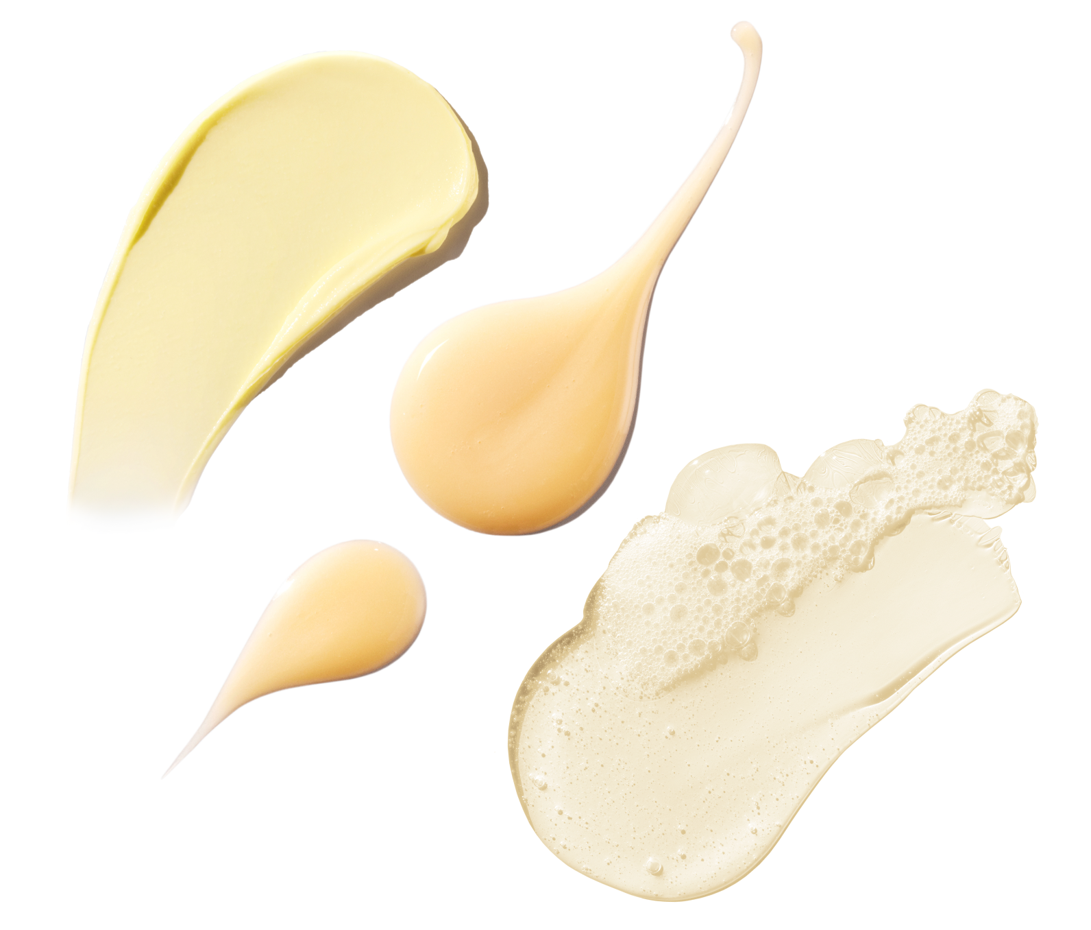Various swatches of beige cream on a white background