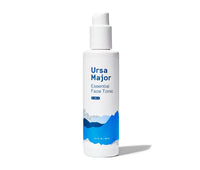 A white and blue bottle of Ursa Major Essential Face Tonic, a 4-in-1 facial toner that cleanses, tones, balances, and hydrates.