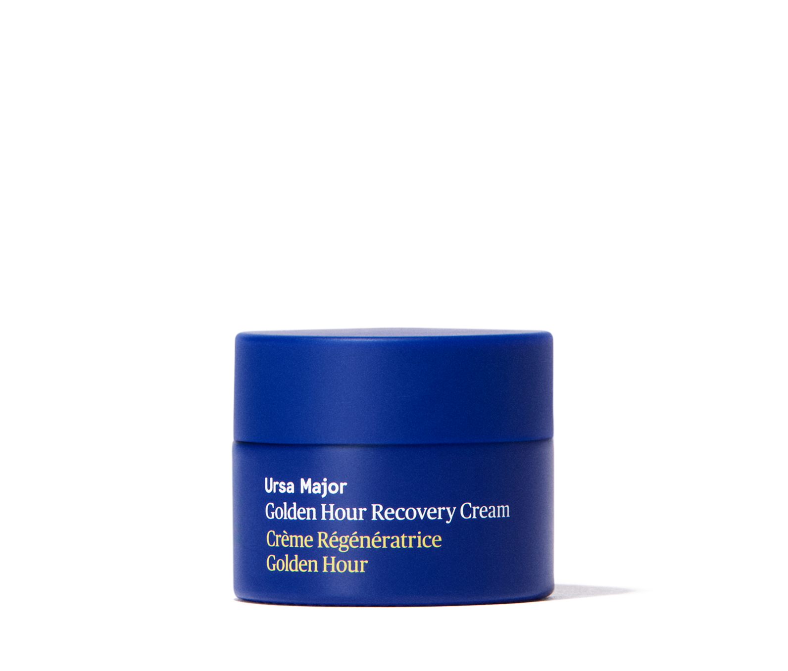 Blue jar of travel-sized Ursa Major Golden Hour Recovery Cream on a white background
