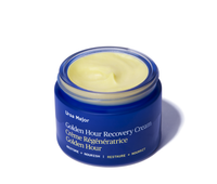 Blue jar of Ursa Major Golden Hour Recovery Cream on a white background
