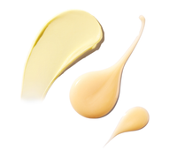 Yellow cream and serum swatches on a white background