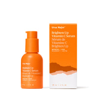 Orange Ursa Major Brighten Up Vitamin C Serum bottle and packaging on a white background