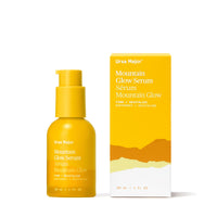 Yellow Ursa Major Mountain Glow Serum bottle and packaging on a white background