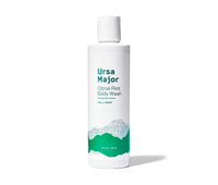 Bottle of Ursa Major Citrus Riot Body Wash.  Bottle is white with green lettering and mountains on it.