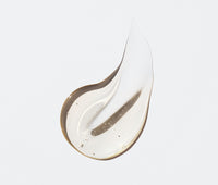 A drop of Ursa Major Citrus Riot Body Wash on a white background.