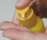 Video of person dispensing a pump of Ursa Major Mountain Glow Serum into palm and smoothing on skin, leaving behind a subtle glow